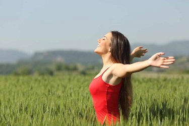 happy woman outdoors in the sun